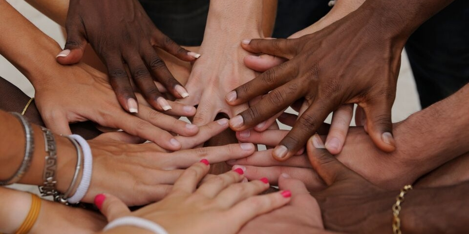 diverse group of hands together